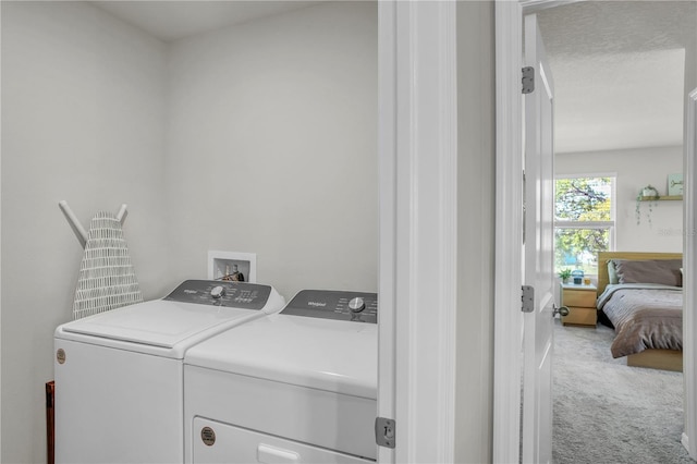 laundry area featuring laundry area, carpet floors, and separate washer and dryer