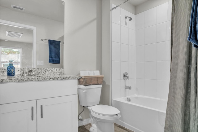 full bath featuring vanity, shower / bath combination with curtain, toilet, and visible vents