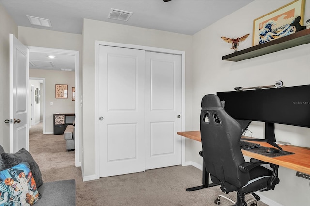 home office featuring visible vents, carpet floors, and baseboards