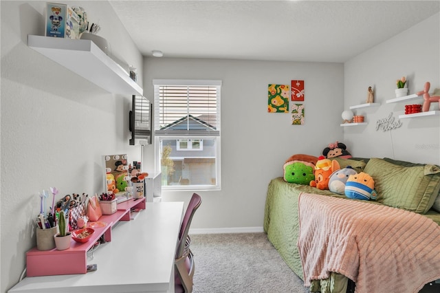 carpeted bedroom with baseboards