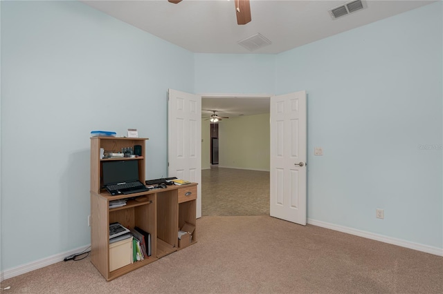 carpeted home office with baseboards, visible vents, and ceiling fan