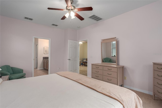 bedroom with visible vents, light carpet, and baseboards