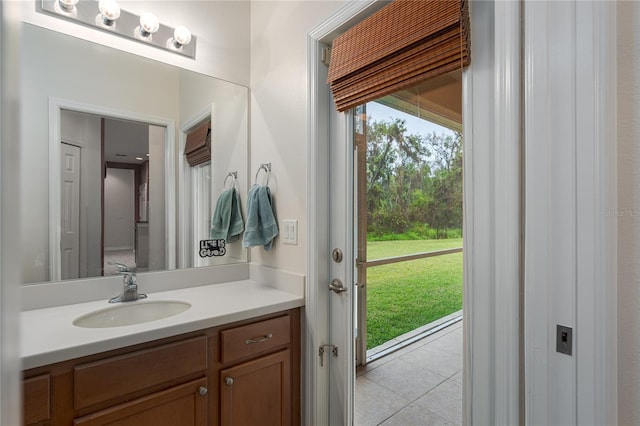 bathroom with tile patterned flooring and vanity