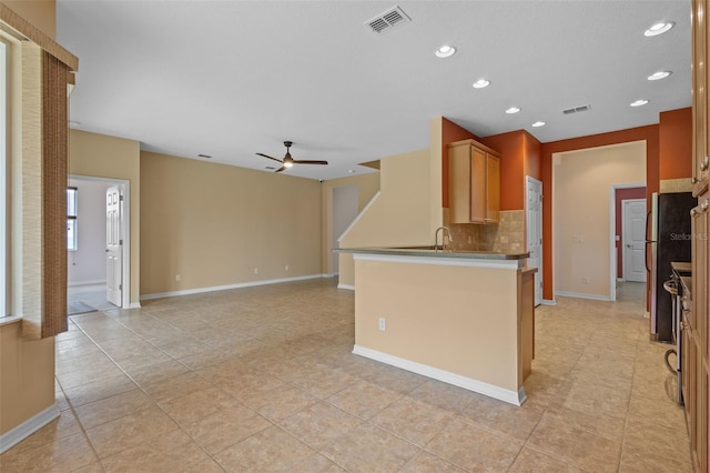 5412 72nd Ter E, Ellenton, FL 34222 - kitchen with a ceiling fan, decorative backsplash, recessed lighting, light tile patterned flooring, and baseboards