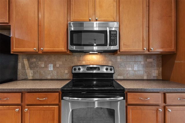 5412 72nd Ter E, Ellenton, FL 34222 - kitchen with appliances with stainless steel finishes and tasteful backsplash