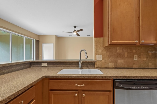 5412 72nd Ter E, Ellenton, FL 34222 - kitchen featuring dishwasher, a sink, ceiling fan, tasteful backsplash, and brown cabinetry