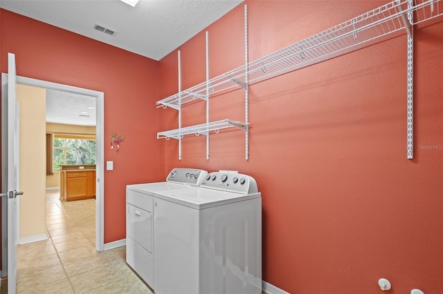 5412 72nd Ter E, Ellenton, FL 34222 - laundry area with separate washer and dryer, light tile patterned floors, and baseboards