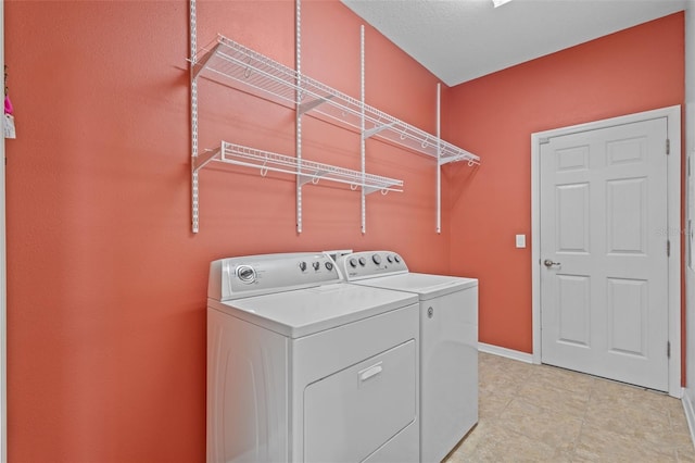 5412 72nd Ter E, Ellenton, FL 34222 - laundry area with washer and clothes dryer and baseboards