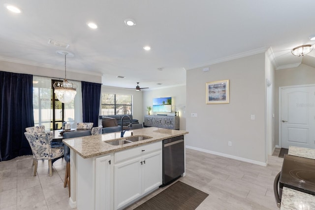 kitchen featuring a center island with sink, a sink, stainless steel dishwasher, open floor plan, and light stone countertops