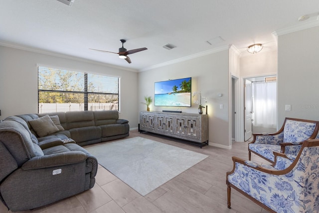 living area featuring visible vents, baseboards, a ceiling fan, and crown molding