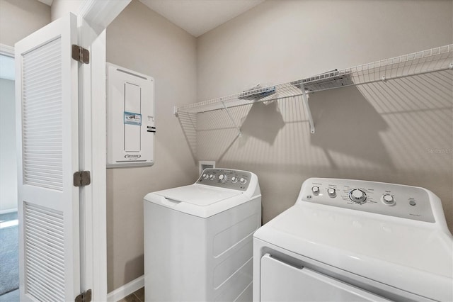 laundry area featuring washer and clothes dryer, laundry area, and electric panel