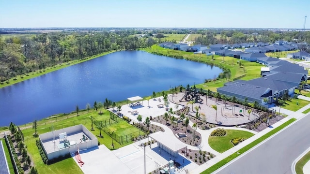 drone / aerial view with a residential view and a water view