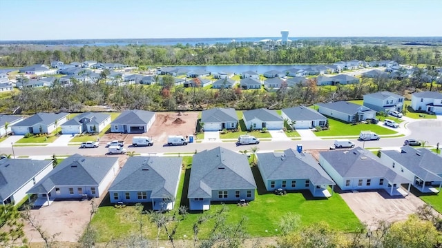 aerial view featuring a residential view and a water view