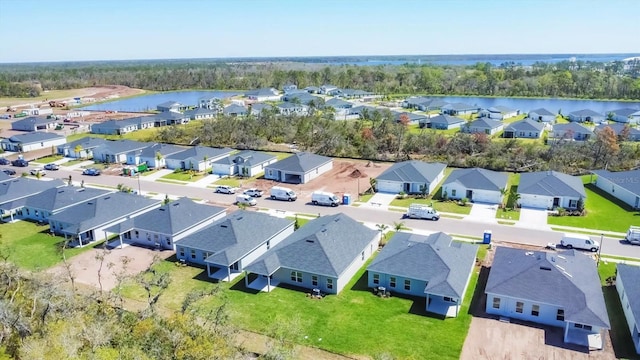 aerial view featuring a residential view and a water view