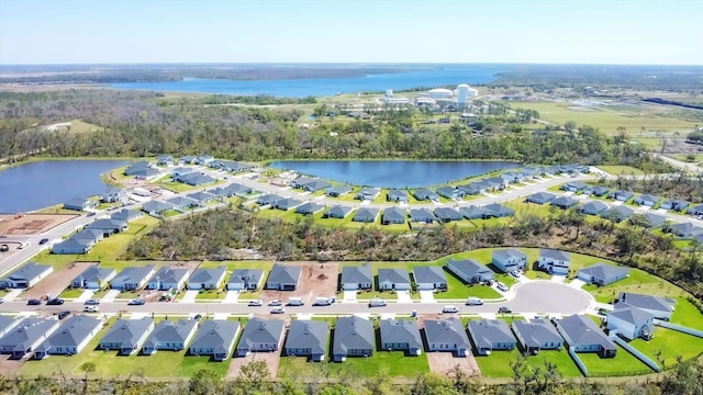 aerial view with a residential view and a water view