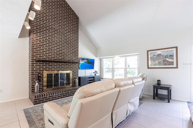 living area featuring light tile patterned floors, a brick fireplace, high vaulted ceiling, and baseboards