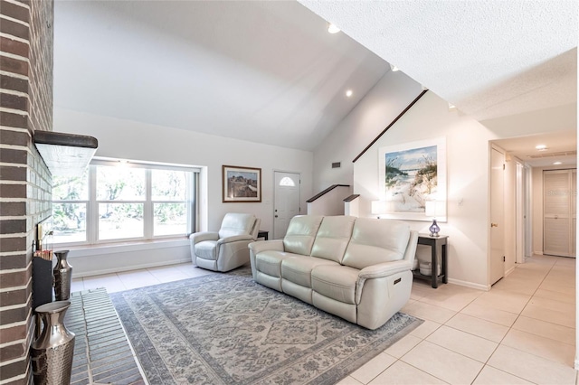 living room featuring baseboards, lofted ceiling, a fireplace, light tile patterned flooring, and a textured ceiling