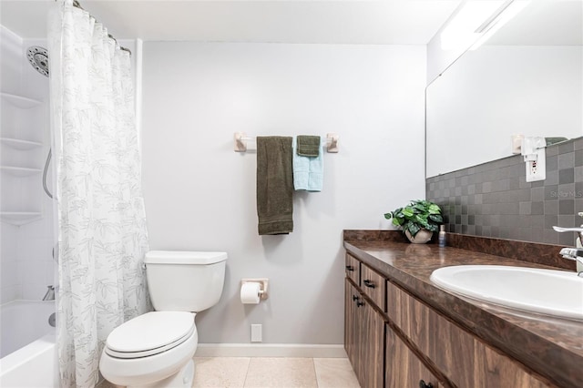 bathroom with vanity, baseboards, shower / bath combo with shower curtain, tile patterned floors, and toilet