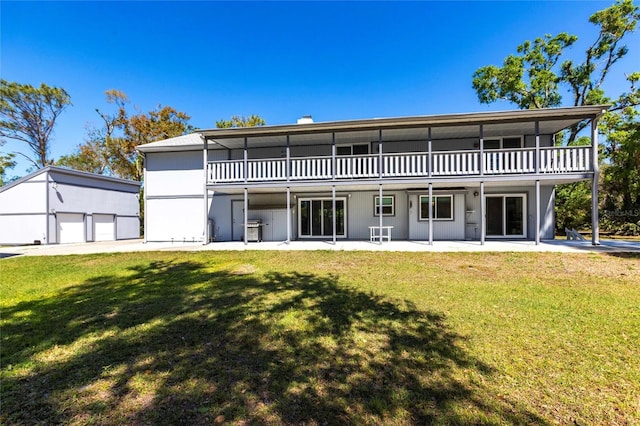 back of property featuring a yard and a patio area