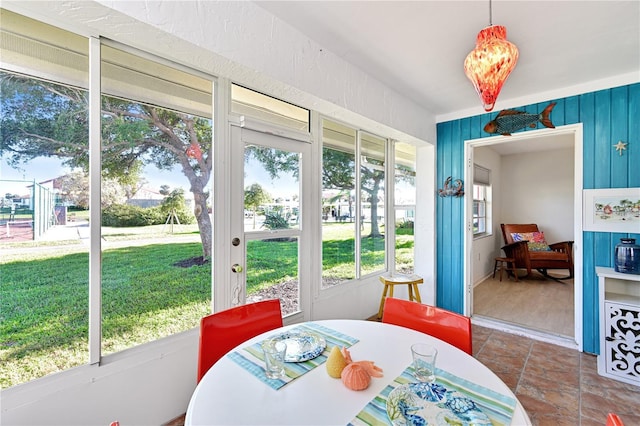 dining area with a sunroom