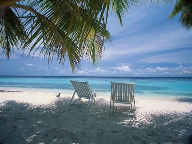 property view of water featuring a beach view