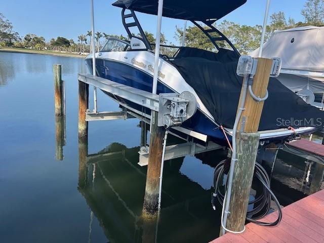 view of dock with a water view and boat lift