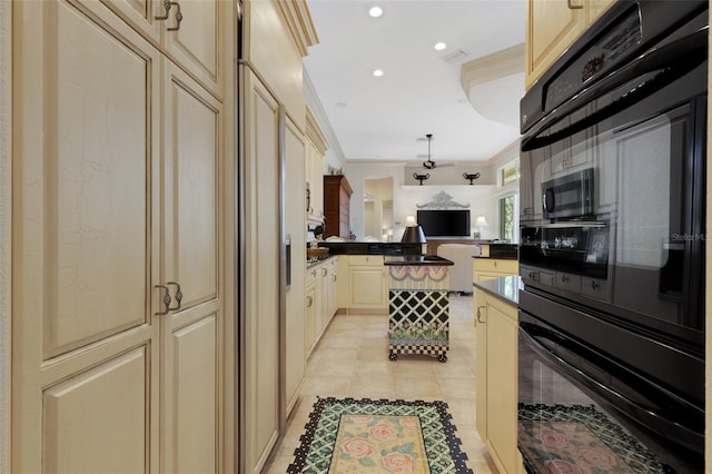 kitchen with ornamental molding, black oven, stainless steel microwave, open floor plan, and a peninsula