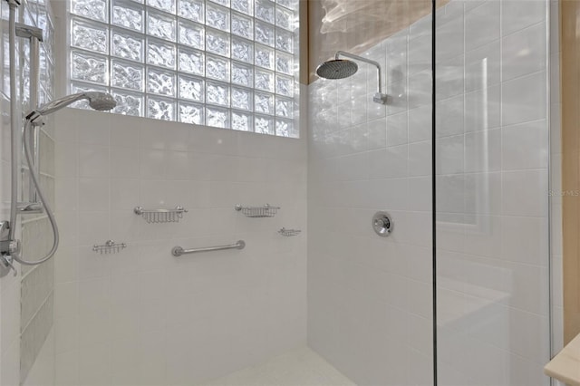 full bathroom with a tile shower