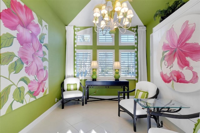 sitting room featuring baseboards and a chandelier