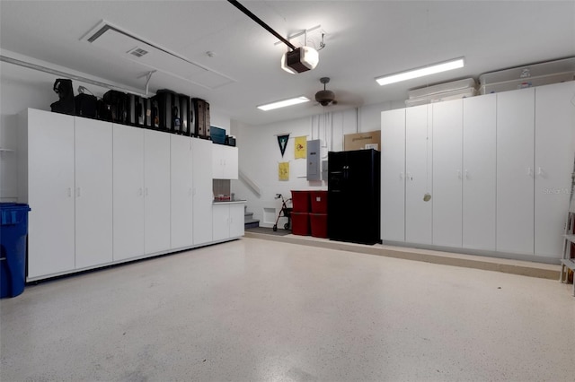 garage with electric panel, a garage door opener, and ceiling fan