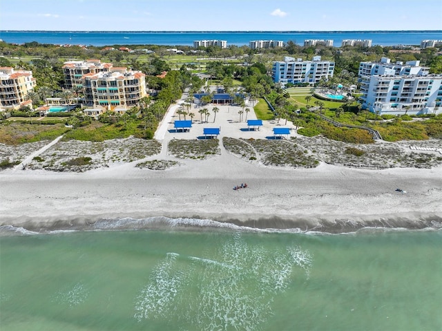 birds eye view of property featuring a water view and a city view