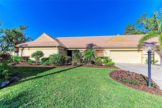 single story home featuring a front lawn, a tiled roof, concrete driveway, stucco siding, and an attached garage