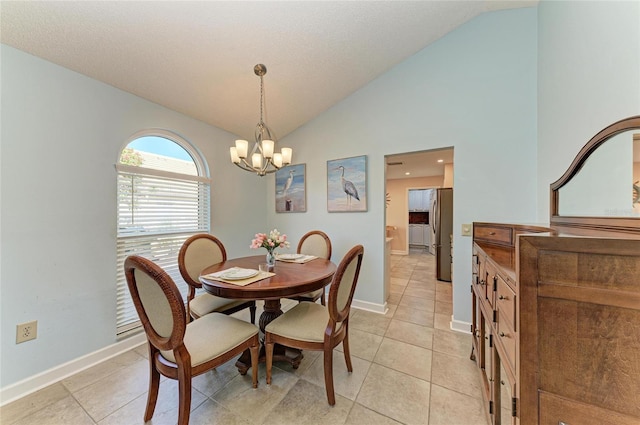 dining room featuring an inviting chandelier, light tile patterned flooring, baseboards, and lofted ceiling