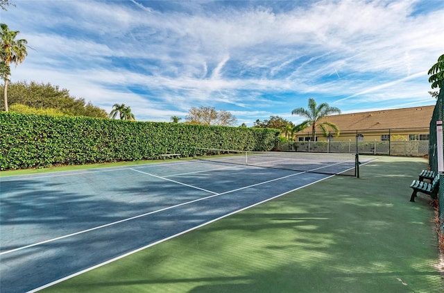 view of sport court with fence