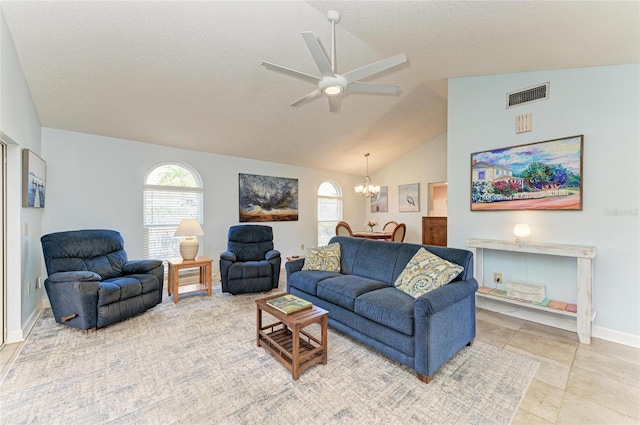 living room featuring visible vents, a healthy amount of sunlight, ceiling fan with notable chandelier, and lofted ceiling