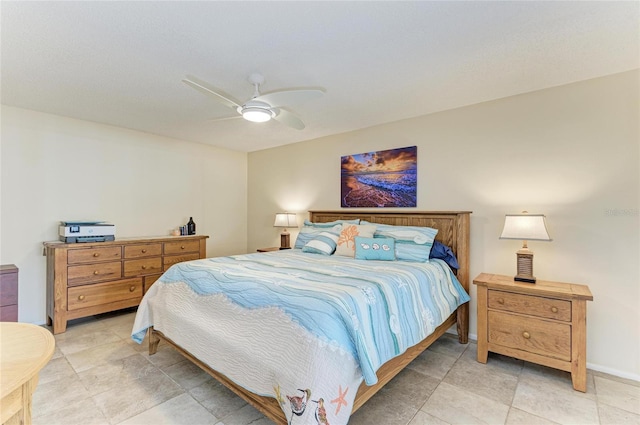 bedroom with baseboards and a ceiling fan