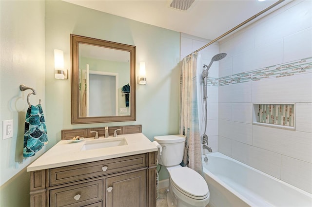 bathroom with visible vents, vanity, toilet, and shower / tub combo