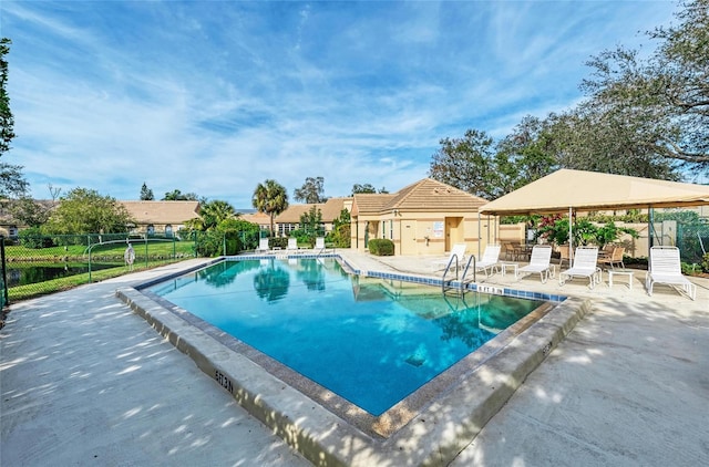 pool with a patio area, a gazebo, and fence