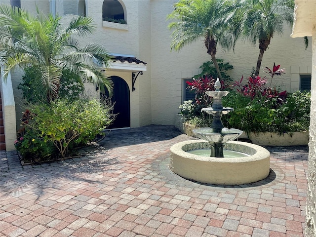 doorway to property with stucco siding