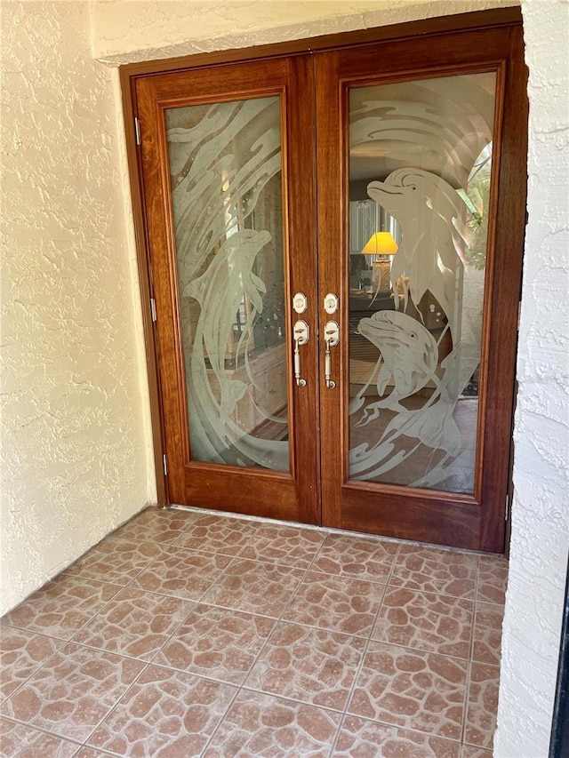 property entrance featuring french doors