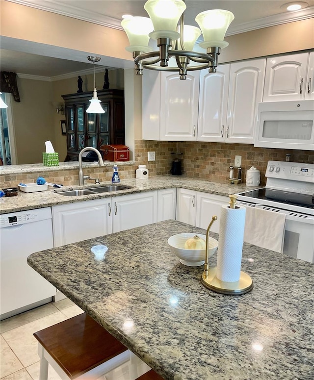 kitchen with white cabinets, white appliances, crown molding, and a sink