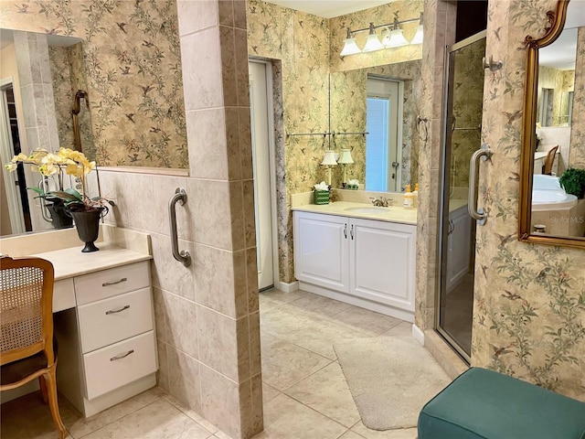 full bath with wallpapered walls, vanity, a stall shower, and tile patterned flooring