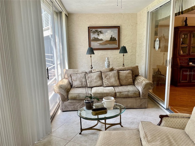 living area with light tile patterned floors