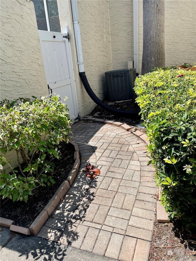 doorway to property with central AC