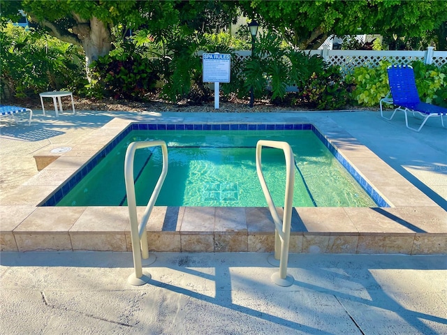 view of swimming pool featuring a swimming pool and a patio