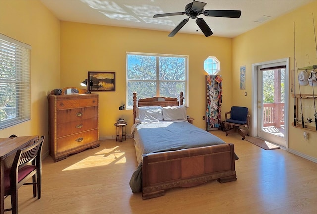 bedroom with ceiling fan, baseboards, light wood-style floors, and access to exterior