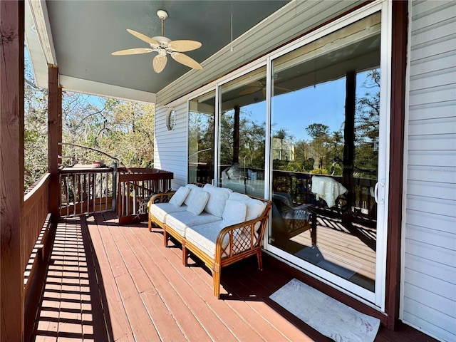 wooden terrace featuring ceiling fan