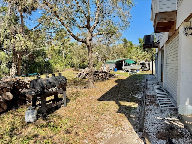 view of yard featuring central AC unit