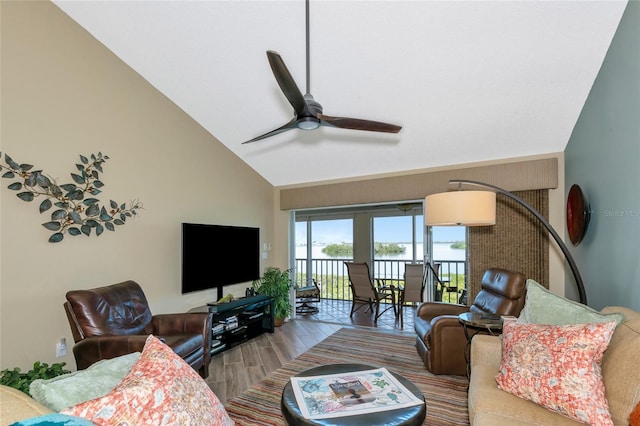 living room featuring high vaulted ceiling, ceiling fan, and wood finished floors