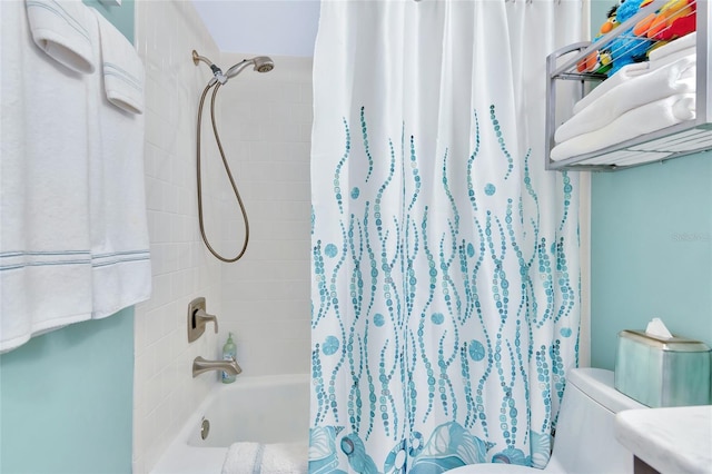 bathroom with shower / tub combo and toilet